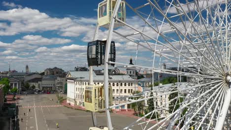 ferris wheel over cityscape on a sunny day