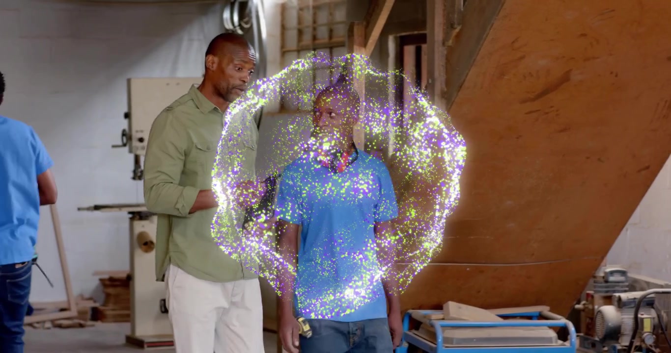 Trainees entering wood shop as portal swirling while instructor placing ear protectors for safety