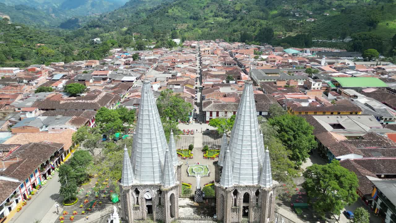Aerial view of the picturesque Andean town of Jardín in Colombia, featuring the central square, the church Basílica Menor de la Inmaculada Concepción and the colonial grid layout