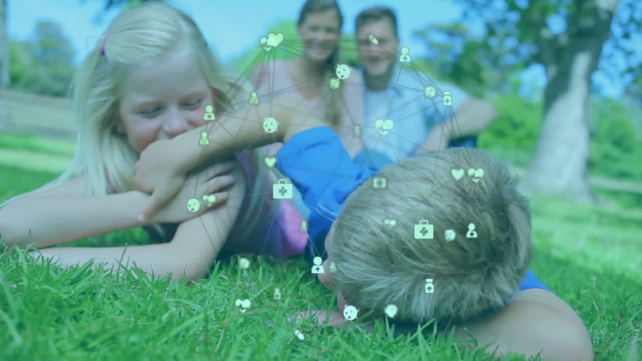 Playing on grass, children with animation of digital health icons in school