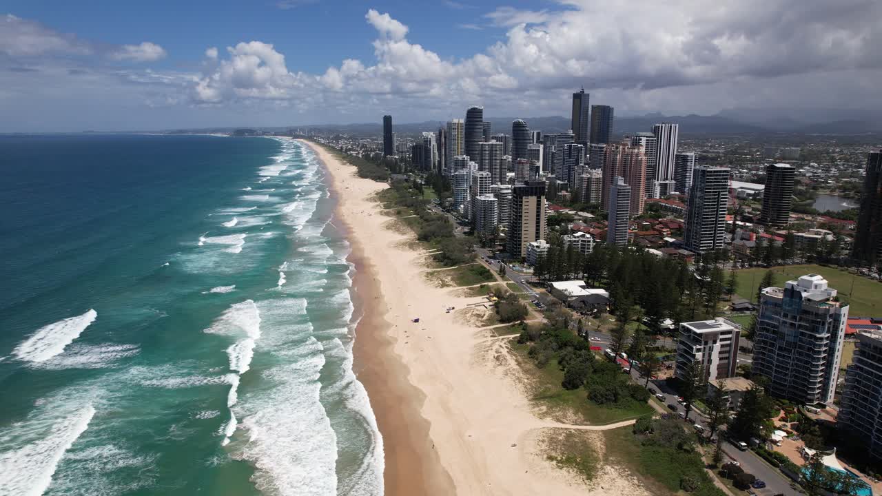 Beachfront Hotels And White Sand Beach At Surfers Paradise In Gold Coast, QLD, Australia. - aerial shot