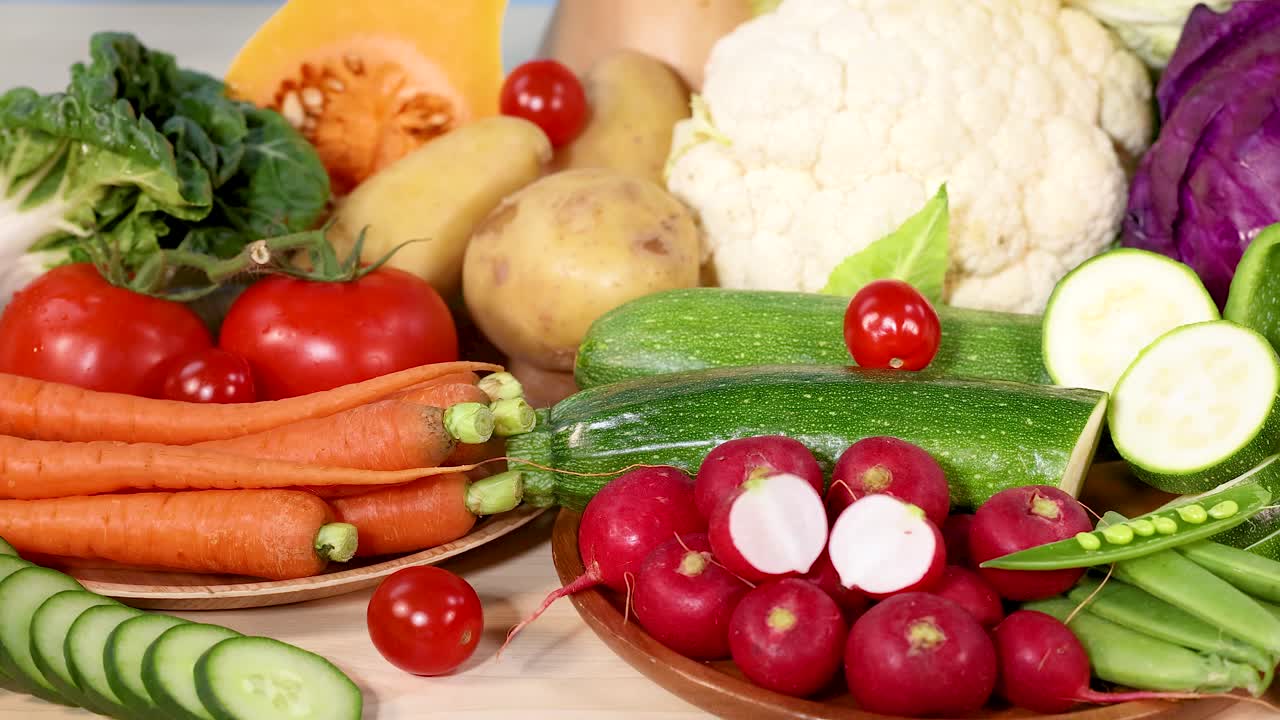A vibrant assortment of fresh vegetables arranged neatly, showcasing their colors and textures in bright lighting