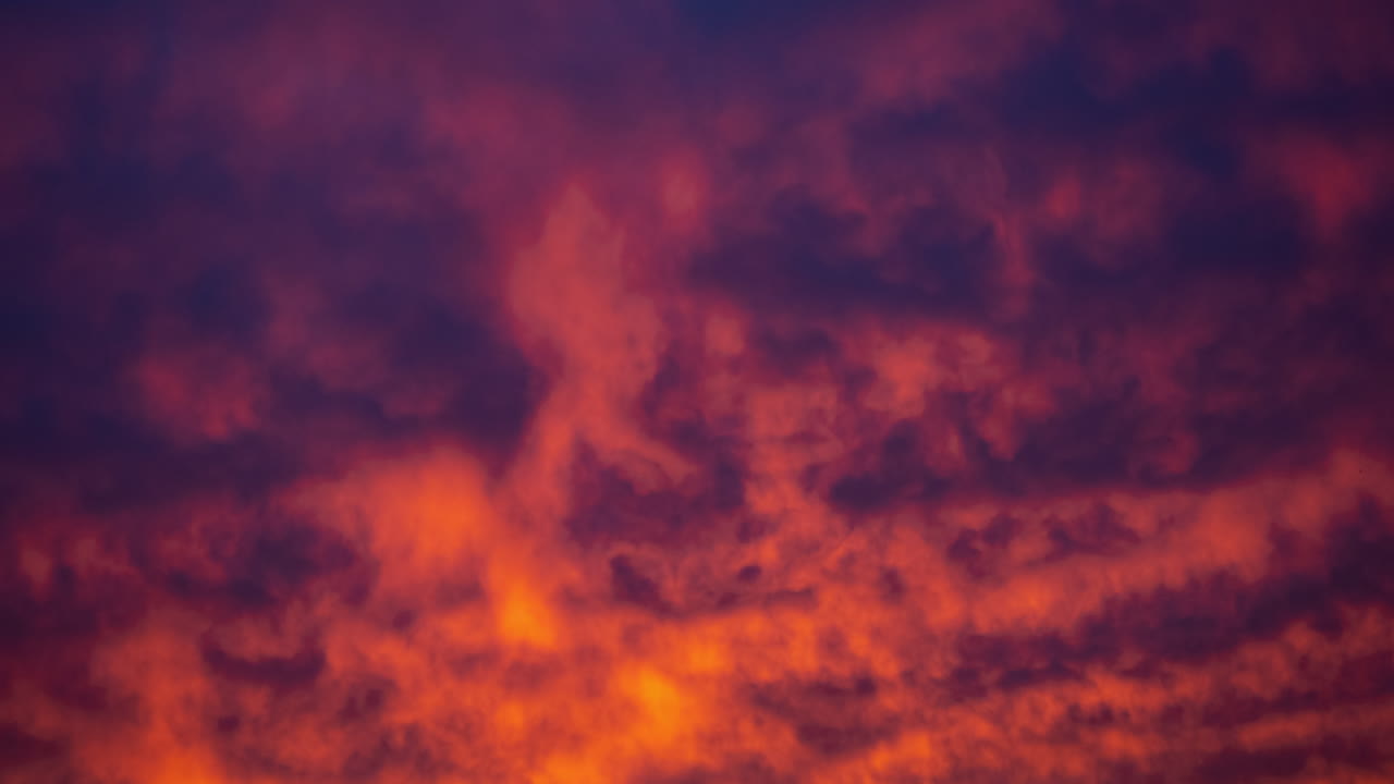 A time-lapse of clouds at sunrise in winter.
