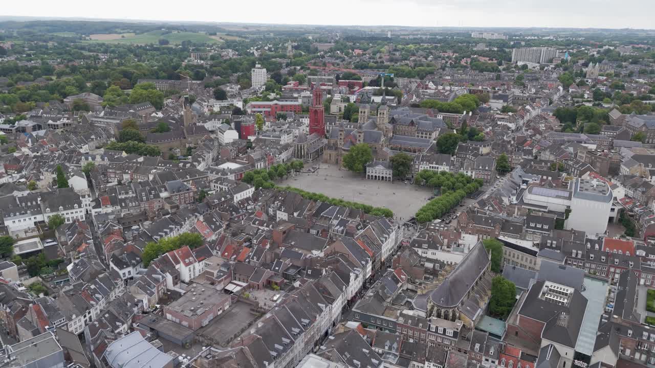 Drone footage of the historic city center of Maastricht in the Netherlands, showcasing old architecture, rooftops, and traditional European streets
