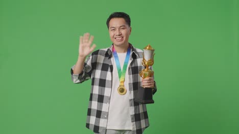 man celebrating a trophy win