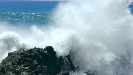 powerful waves crashing on rocky coastline