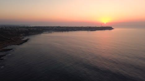 Sunset-over-seascape-drone-view-of-Campoamor-beach-in-Spain