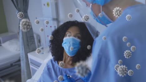 animation of virus cells over biracial female surgeon with african american female patient