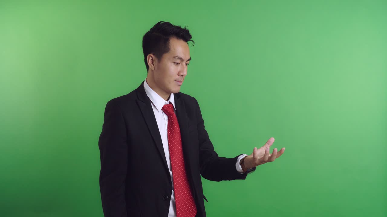 Businessman in suit reaching out