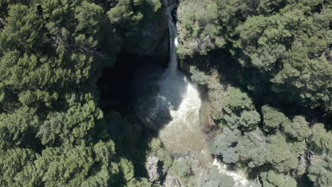 AERIAL---Rio-Bonito-waterfall-and-forest,-Patagonia,-Neuquen,-Argentina,-rising-tilt-up