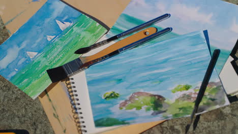 watercolor paintings of seascapes and art supplies