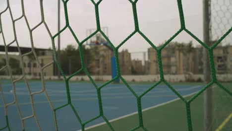 close up on net of soccer goal in local sports playground