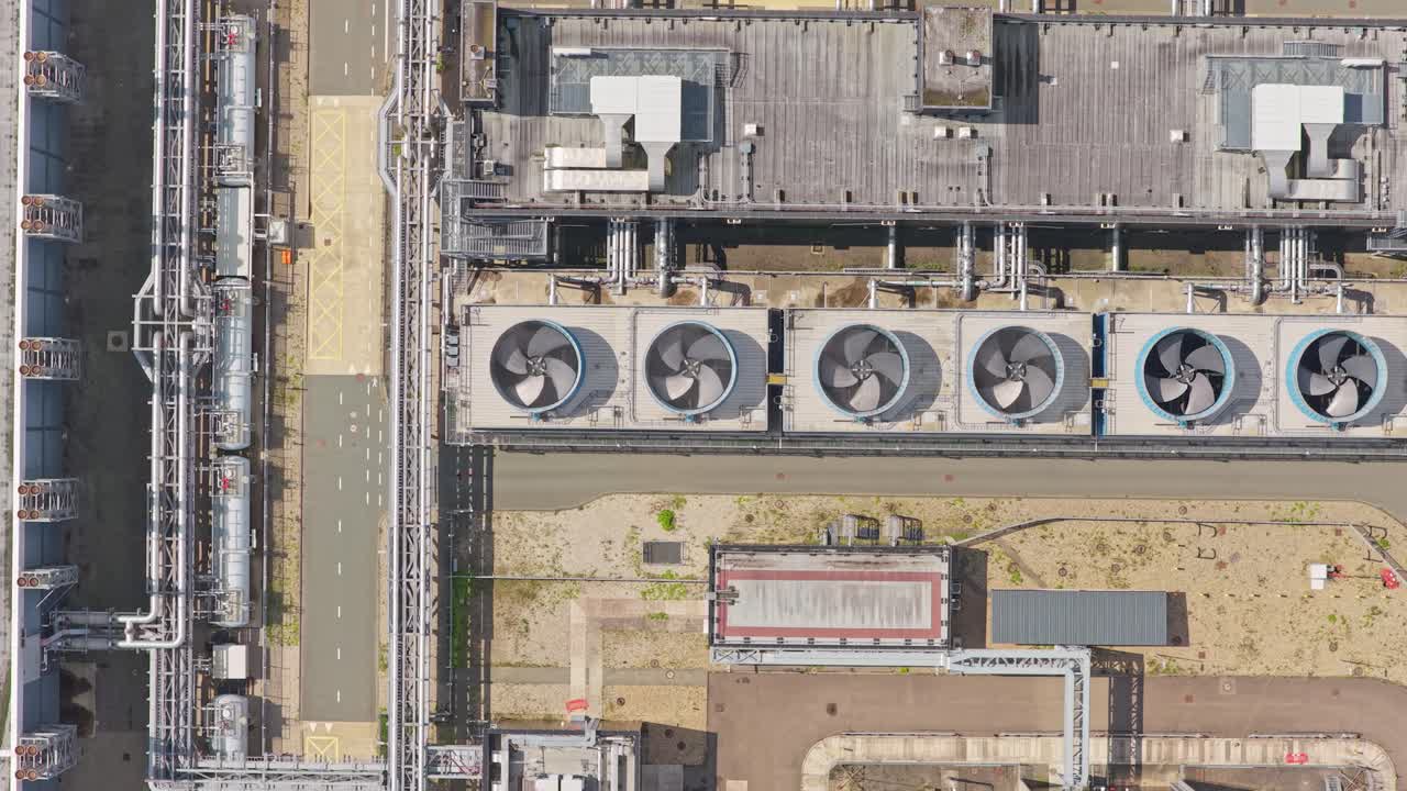 Internet infrastructure hub, data building with cooling towers, aerial capture