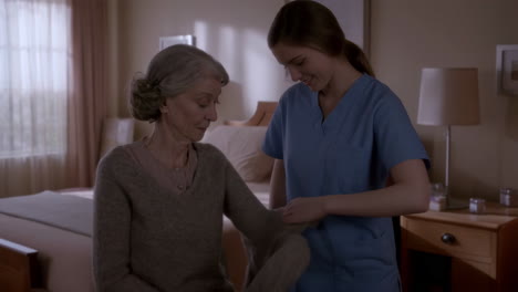 a caregiver assisting an elderly woman in a room