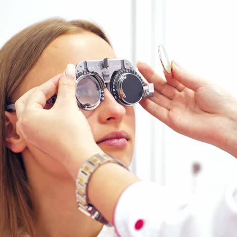 woman checking eye vision