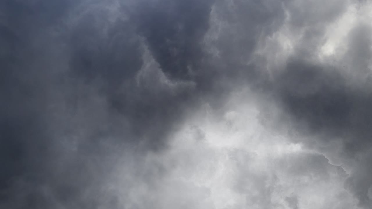 thick gray clouds in the sky with thunderstorm