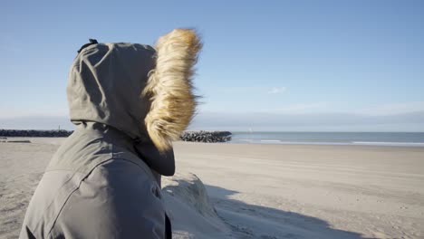 Person-with-burnout-taking-a-breath-of-fresh-sea-air