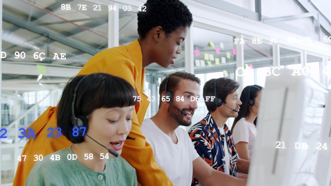 Lead approaching leaning over call reps, scanning screens and coaching, code overlaying faces