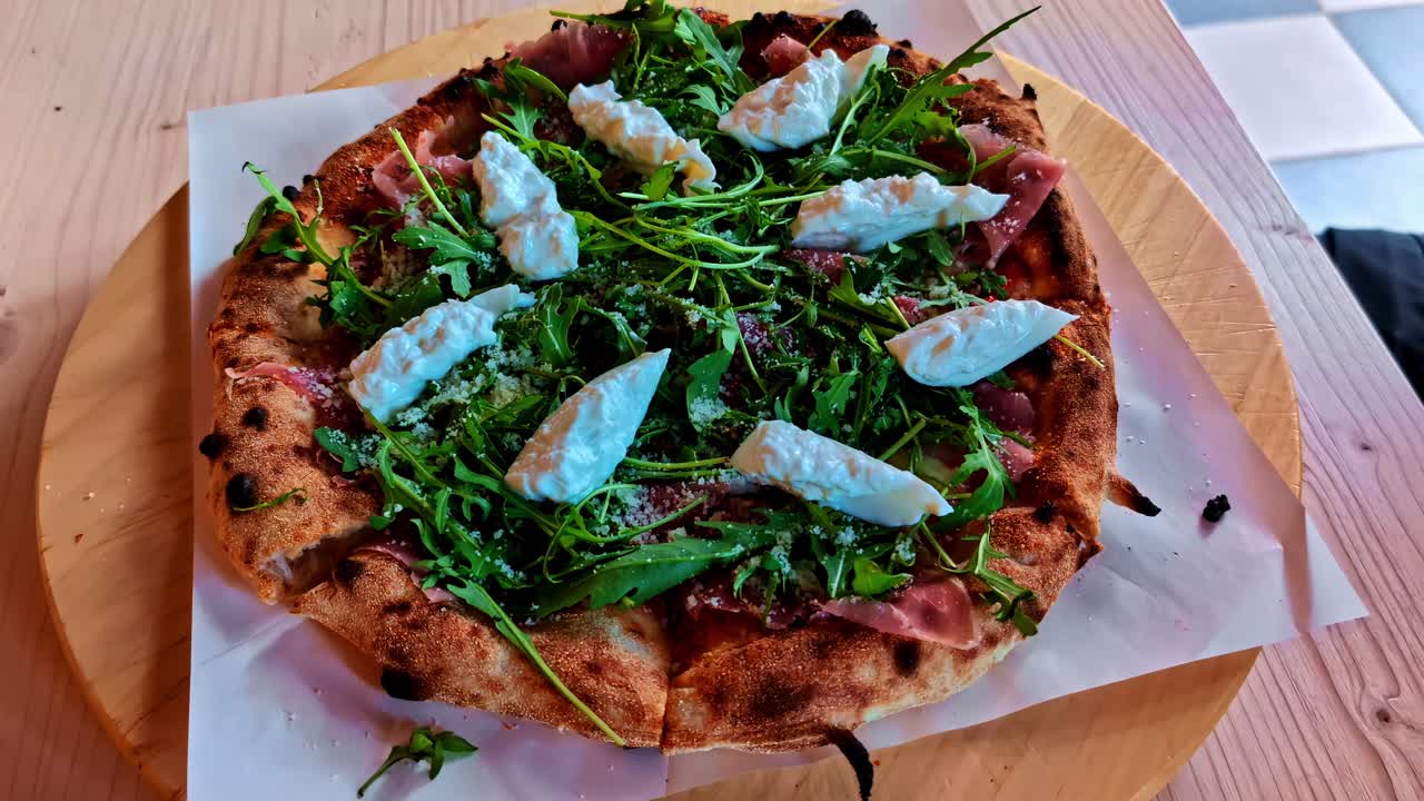 Neapolitan-style pizza soft airy crust charred edges topped with fresh ingredients