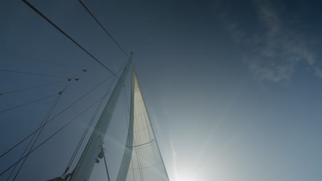 flapping sails on a sunny day on a sailboat