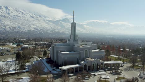 aerial drone view of mount timpanogos lds mormon temple in utah winter