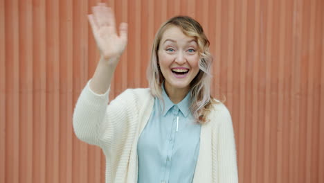 woman waving happily