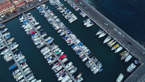 bird eye view at formation of boats and yachts docked at port