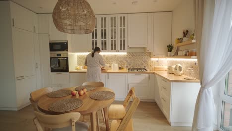 a pregnant woman enjoying her daily routine at home, relaxing in the living room and eating in the kitchen. the scene highlights comfort, maternity, and moments of self-care in a cozy setting