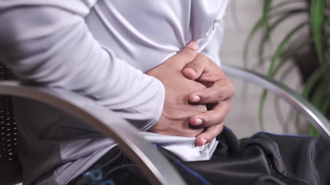 Man Experiencing Abdominal Pain