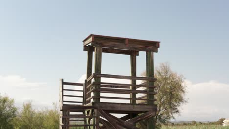 wooden tower with clouds on bright sky in the background