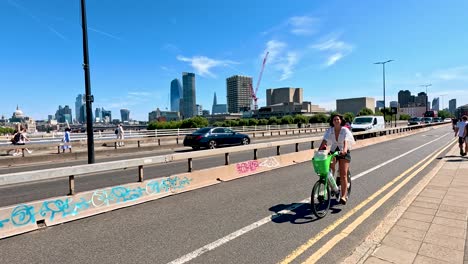 cyclists and pedestrians on a sunny day