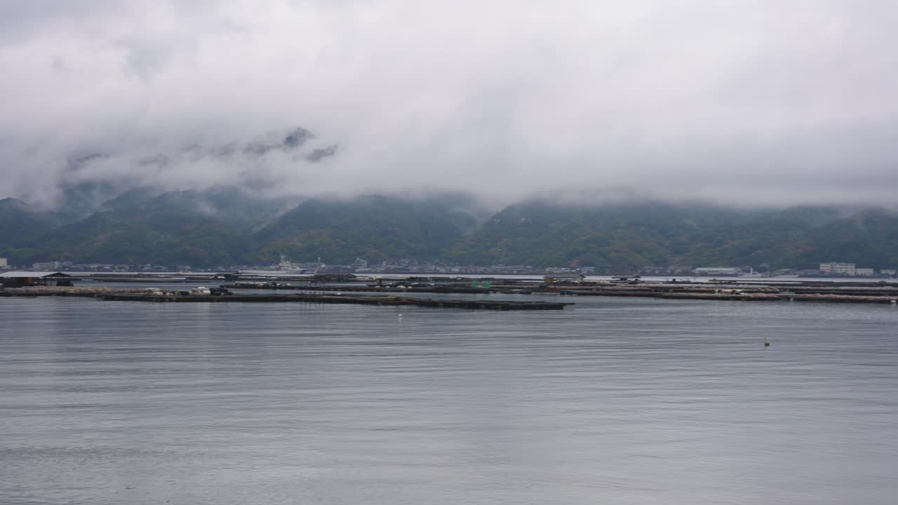 Etajima and Hiroshima Coast with Oyster Farms on Misty Day in Japan