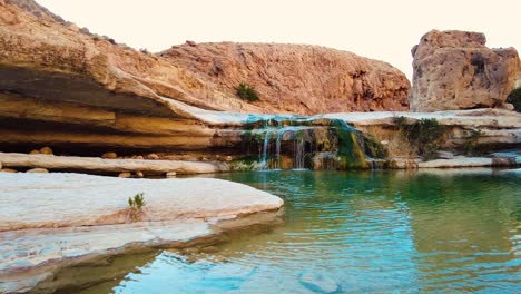 a waterfall in the middle of the sahara desert algeria biskra