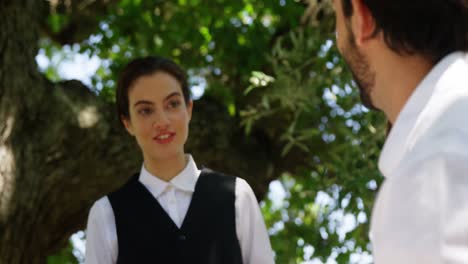 couple interacting with waitress