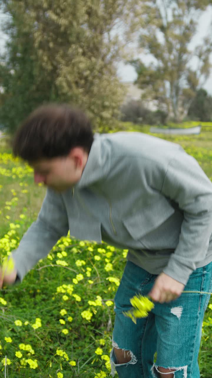 Happy Man Selecting The Flowers From The Ground For A Gift