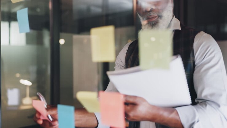 Strategy, planning and black man with sticky notes