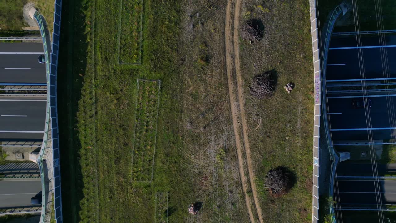Aerial view showing wildlife crossing over highway in Germany ensuring environmental protection. speed ramp hyper motion time lapse Breathtaking aerial view flight ascending raise up drone