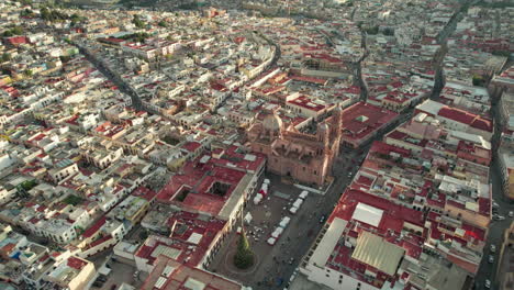 stunning drone footage showcasing a half orbit around the iconic cathedral and plaza de armas in zacatecas, capturing the essence of this historic city from the sky