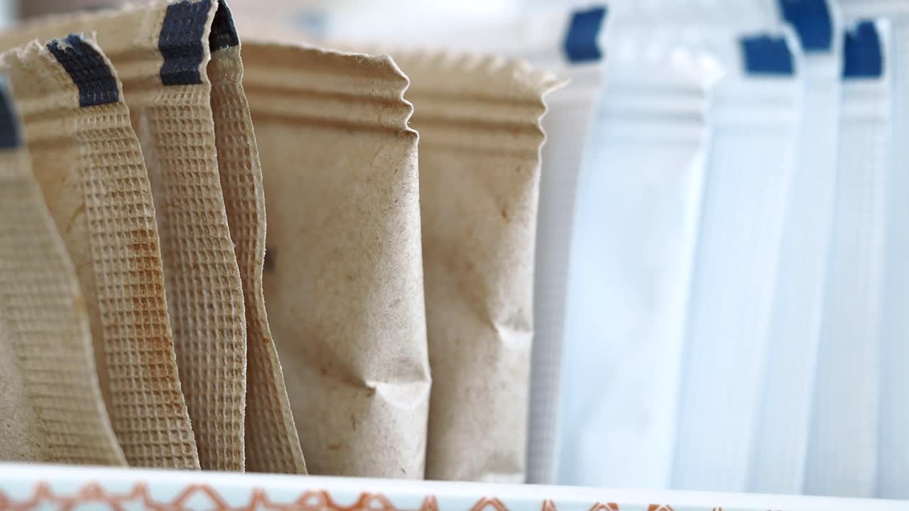 A row of various individual serving packets