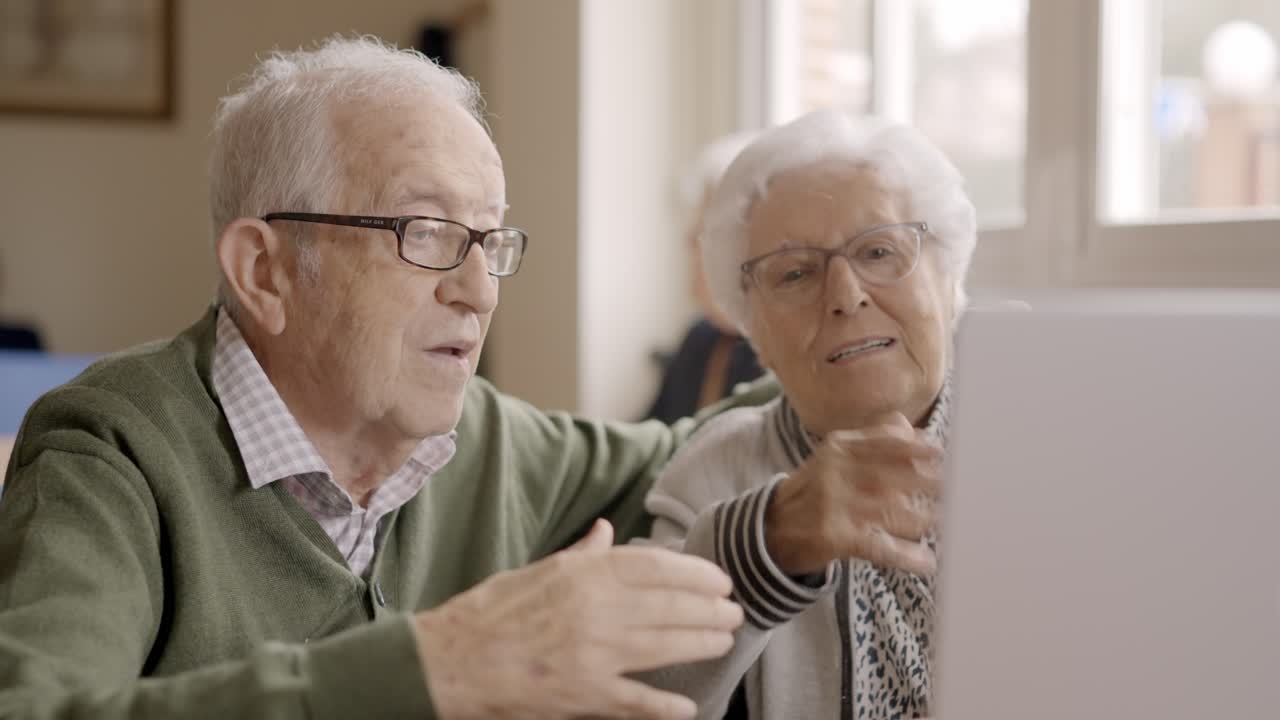 Senior people blowing a kiss during a video call
