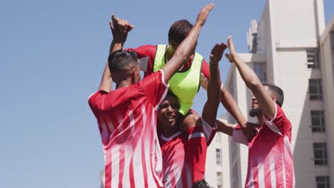 soccer players celebrating on field