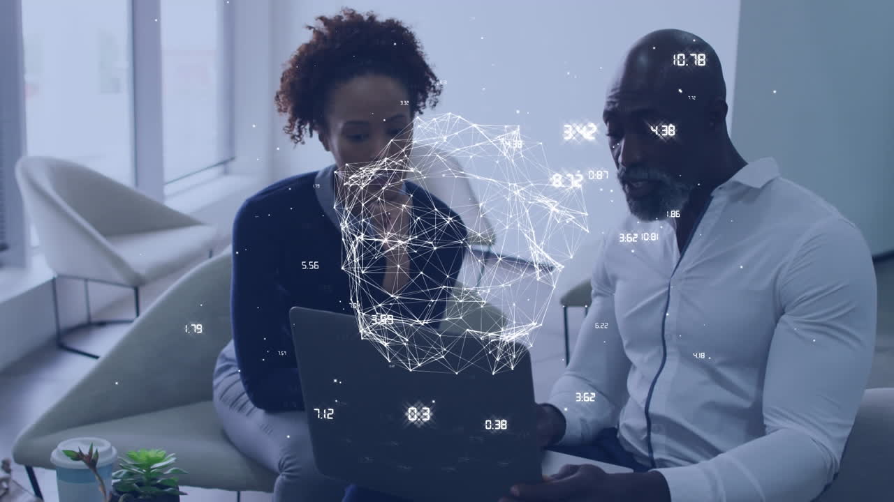 Animation of spinning globe over african american businessman and businesswoman discussing at office