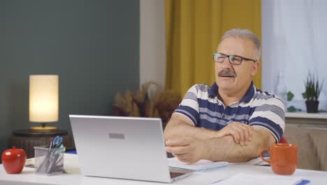 home office worker old man having a heart attack.