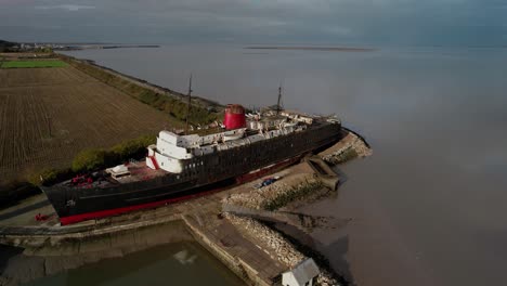 push in aerial shot over the tss duke of lancaster aka the fun ship in north wales near moyston docks