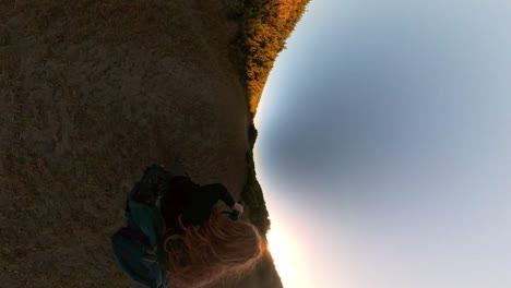 Vertical-shot-of-photographer-with-red-hair-in-Oregon