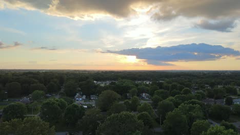 flying over some houses during sunset in clarksville, tennessee