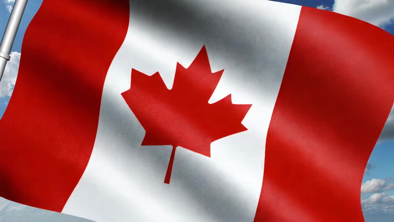 Waving Canadian flag on pole moving by light breeze over blue sky, showing red maple leaf