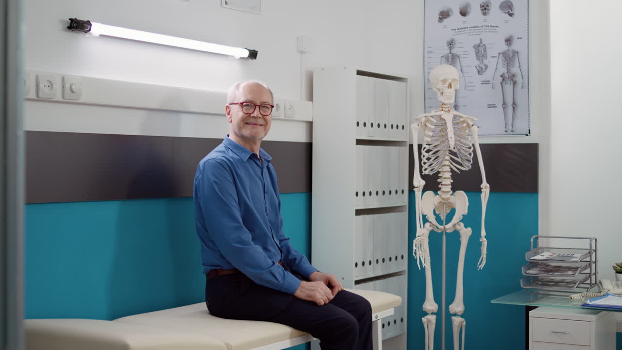 Senior Patient in Doctor's Office with Human Skeleton Model