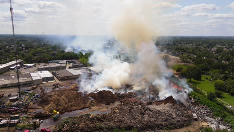 Mulch company catches fire, Detroit, Michigan, USA, aerial view