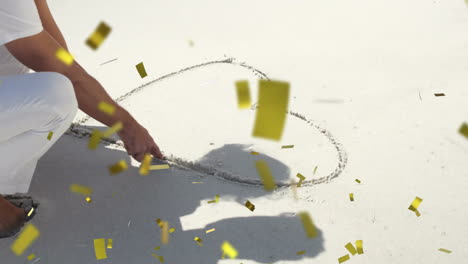 drawing heart shape in sand, person surrounded by falling confetti animation